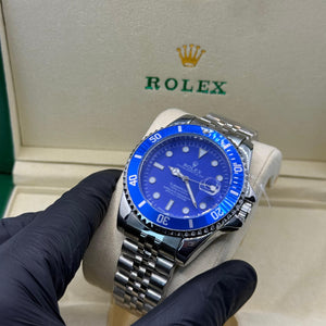 Rolex submariner silver with blue rotating dial with date Saloora